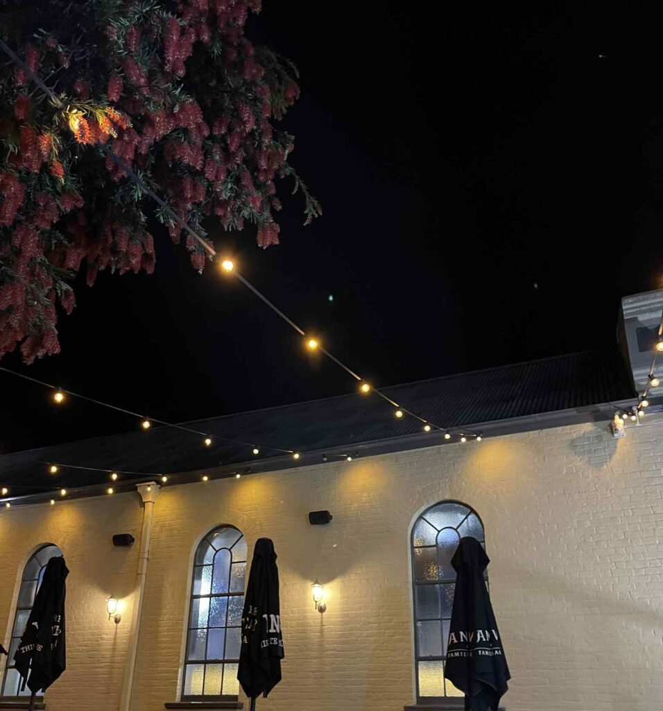 Williamsburg Tamworth - electrical festoon lighting creating a warm garden ambience